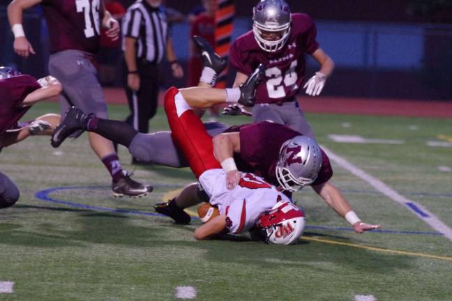Newton Braves keep rolling Newton linebacker Ryan Kaiser forces Whippany Park ball carrier Matthew Peck to the turf in the first quarter. Kaiser accomplished seven tackles and one sack. Photos by George Leroy Hunter