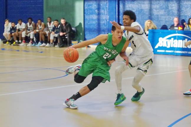 Ocean County's Carson Glenn Francisco dribbles the ball as he moves past Sussex County defender Carlton Sears in the second half. Francisco scored 10 points.