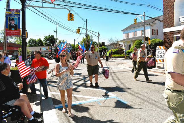 Photos: Memorial Day Parade in Newton Flags are handed out to spectators during the parade.