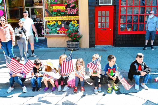 Photos: Memorial Day Parade in Newton Children hold flags handed out during the parade.