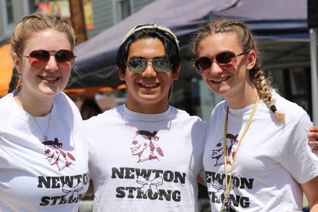 Newton Day 2019 Caroline Fox, 17, Angelico Villaruz, 17 and Lanie Scuralli, 17, friends of the departed Lexi Faye, are responsible for starting the sale of the shirts to add to the scholarship fund, as "just another way to see that Lexi is never forgotten."  Noting that the support has been unprecedented, Scuralli added, "We think about her every single day.  At school, they put a fresh white rose on her desk, every day. Nobody else sits at her desk, in any of her classes."