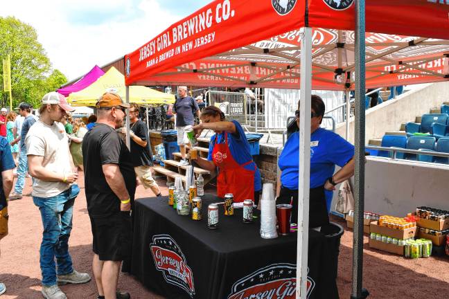 Miners open 10th season <b>People line up for beer.</b>