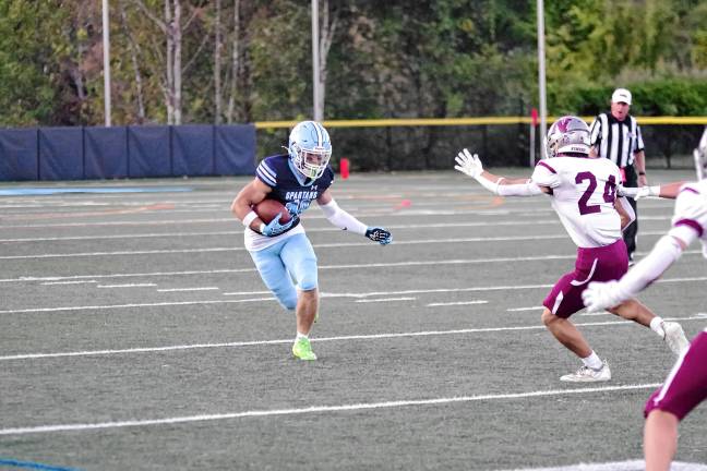 Football roundup: High Point remains undefeated <b>Sparta ball carrier Christian Brevig runs.</b>