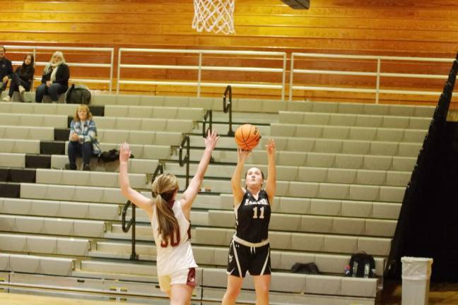 Wallkill Valley's Rebecca Krueger launches the ball toward the hoop in the second half. She scored six points and grabbed five rebounds in the game against Newton.