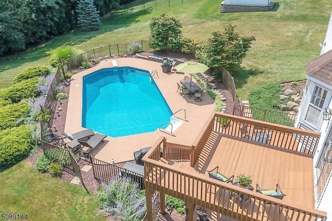 Home with classic beauty is nestled in a mature landscape Home with classic beauty is nestled in a mature landscape