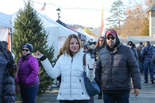 Alicia and Michael Bianchi of Hopatcong made their down the Christmas Boardwalk after a shuttle ride in.