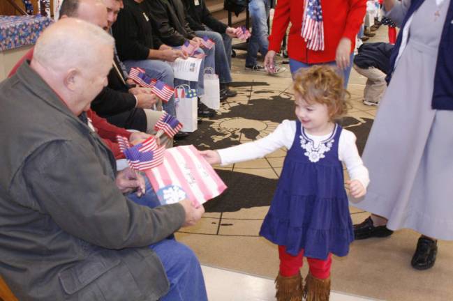 Camp Auxilium honors veterans Haylee Boyle hands her Grandpa a hand-made card.