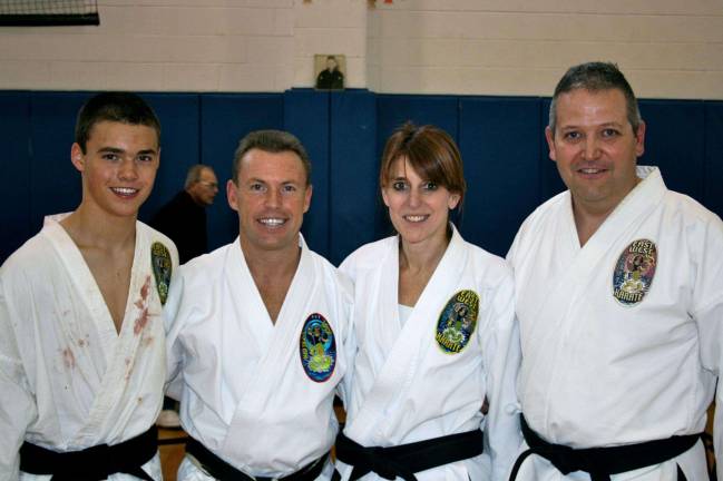 East West Karate Winter shiai promotions From left, Jesse Huselton, Sensei Klinger, Annemarie Schlomann, and Ray Reisen