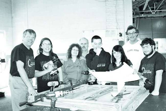 Students help with 150th celebration Pictured left to right is Jim Hoffmann, Robotics Program Director at Newton High School, Caitlin Bailey, Heidi Hoskins, Brad Hoskins, Brad Howie, Cassie Yauch, Kevin Elvidge, Newton Deputy Mayor and Chairman of the 150 Anniversary Committee, and Brian Hoskins.