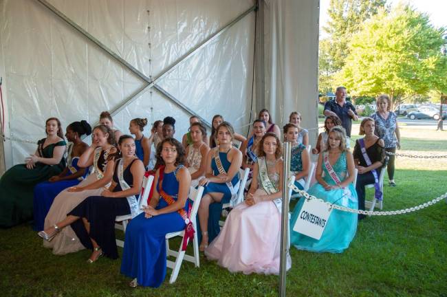 All 21 of the Queen of the Fair contestants waiting for the pageant to begin
