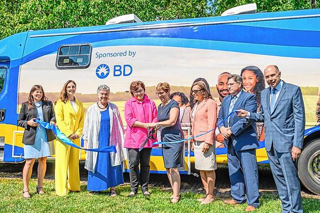 Zufall readies new mobile medical unit Executives from Zufall Health and lead sponsor BD cut a ribbon on the new mobile medical unit. From left are Ami Simunovich, BD chief quality & regulatory officer and public affairs; Carla Burigatto, BD chief communications officer; Peg Zufall, a Zufall board member; Shana Neal, BD chief people officer; Fran Palm, Zufall president and chief executive; Annette Gonazlez, Zufall chief operating officer; David Woods, Zufall senior vice president of external affairs; and Peter Wolfson, Zufall Health Foundation board president. (Photos by April Ludwig)