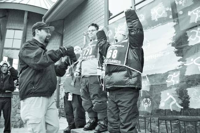 Snowboarders, skiiers share Olympic successes Shawn Barber of Highland Lakes is jubilant as he prepares to receive his medallion. He won a gold medal for his performance in the Intermediate Super G. To his left is Kyle Degroat of Stillwater, who won gold medals in the Intermediate Super G and Intermediate Slalom. Both are members of the Vernon Mountaineers team.