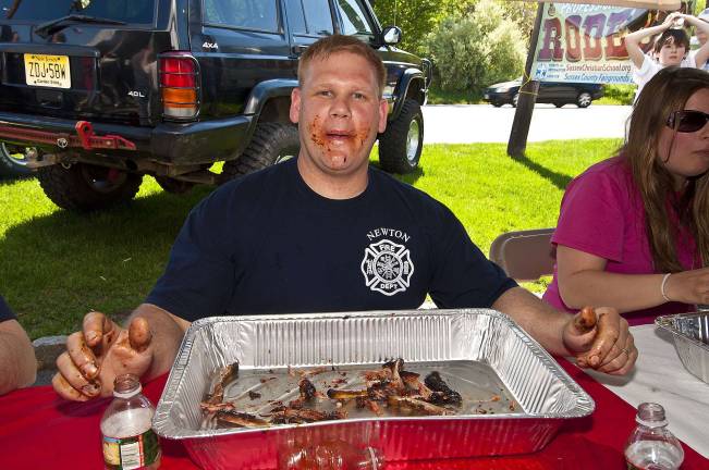 Teenager downs rack of ribs in 2 minutes Bryan Fanance of the Newton FD is a little messy after giving it his best shot