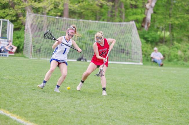 KRHS girls varsity lacrosse defeats High Point Kittatinny's Mikayla Cooke and High Point's Rebecca Sanderson maneuver for control of the ball.