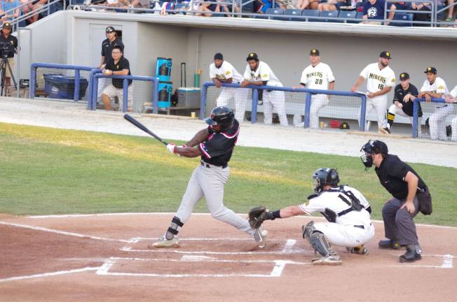 Miners win one of three from Jackals The ball skips foul off the bat of Jackal Joe Dunigan in the first inning.