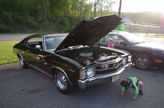 Classic cars cruise into Branchville Youngsters check out a 1971 Chevy Chevelle.