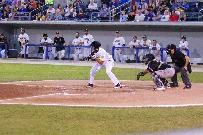 Miners win one of three from Jackals Miner Carlos Lopez squares to bunt in the second inning.
