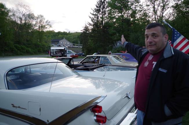 Classic cars cruise into Branchville Victoria Diner owner Michael Hatzimihalis talking about the cars. Hatzimihalis is also a Rockaway Township police officer.