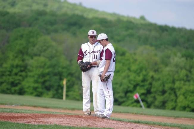 Newton loses to Lodi in baseball Newton Braves Joe Maker and Cole Van Luvender discuss things on the mound.