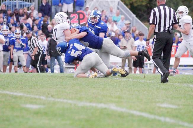 Kittatinny defensive linemen sack Wallkill Valley quarterback Alex Mastroianni in the second half. Mastroianni passed for 119 yards. Mastroianni ran for a touchdown and threw one touchdown pass.