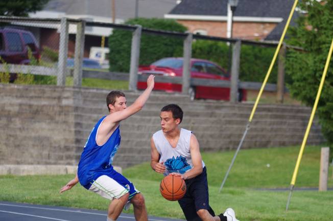 Smalley beats Basket in summer basketball Team Basket's Luke Basket dribbles the ball past Team Smalley's Colby Thomas.