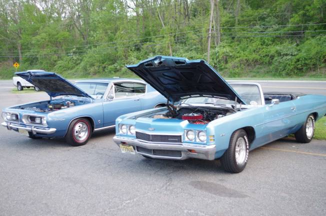 Classic cars cruise into Branchville A 1967 Plymouth Barracuda alongside a 1972 Chevrolet Impala Convertible.