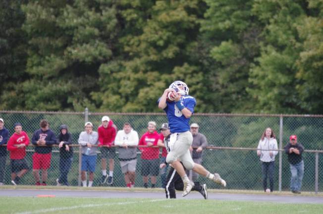 Kittatinny receiver Austin Seames catches the ball resulting in a 58 yard touchdown pass reception in the fourth quarter. On defense Seames intercepted the ball and returned it 75 yards for a touchdown in the first quarter.