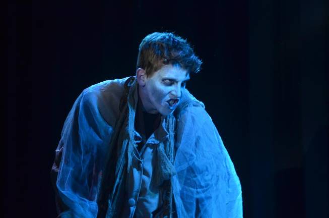 Junior Declan McHale, playing the role of the spirit of Jacob Marley, acts out scene during rehearsal of the Pope John Players’ production of “A Christmas Carol” on Monday at Pope John XXIII Regional High School.