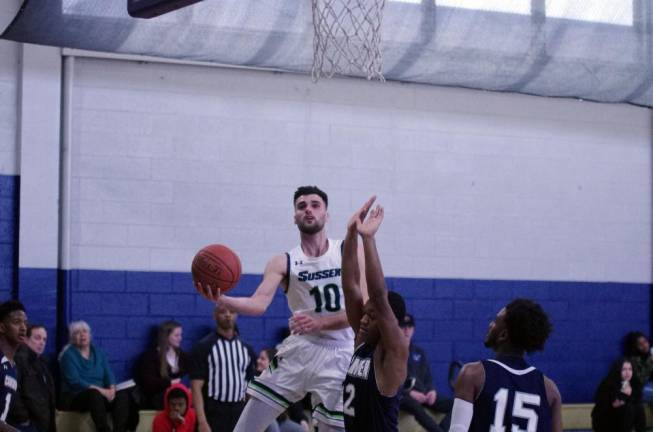 Sussex County's Reldi Durrsi raises the ball towards the hoop in the first half.