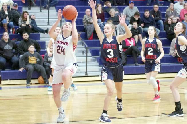 Lenape Valley's Ali Difabrizio begins to leap skyward with the ball during a shot in the first quarter. Difabrizio scored 2 points, grabbed 4 rebounds and blocked 3 shots.