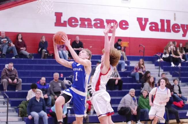 Kittatinny defeats Lenape Valley in boys' varsity basketball Kittatinny's Brian Plath raises the ball towards the hoop during a shot while covered by Lenape Valley's J.J. Worthington in the second half. Plath scored 19 points.