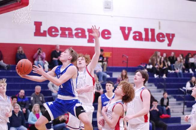 Kittatinny's Brian Plath raises the ball towards the hoop during a shot in the second half. Plath scored 19 points.