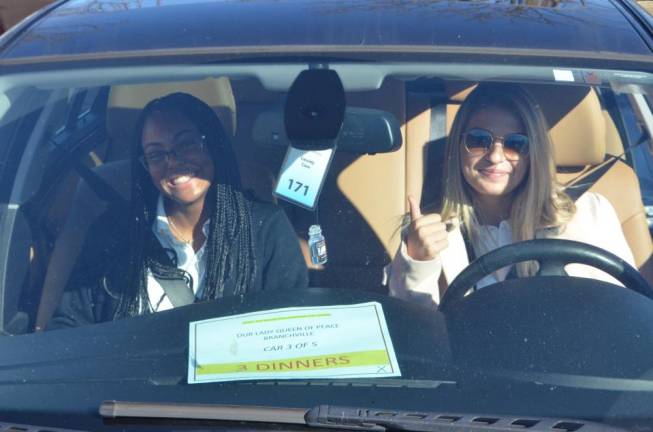 Community delivers holiday meals All loaded up with Thanksgiving meal items and ready to go deliver them.