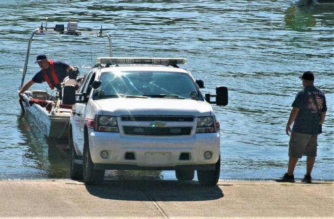 Rescue workers search for the body of a missing man on Greenwood Lake.