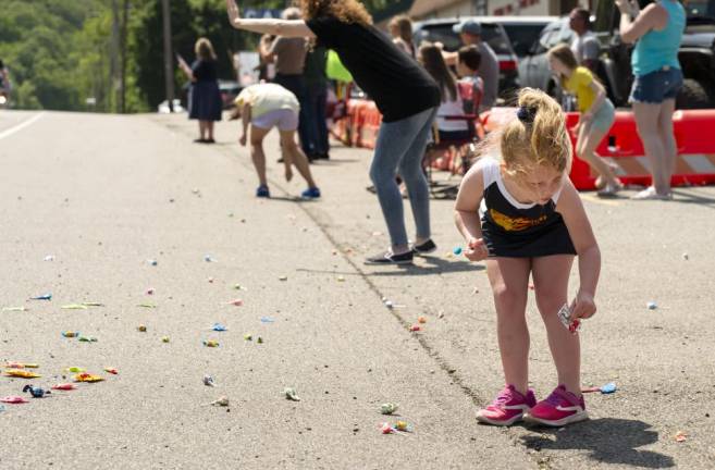 BP5 Elliot Bilade, 4, of Cranberry Lake picks up candy after the parade goes by.