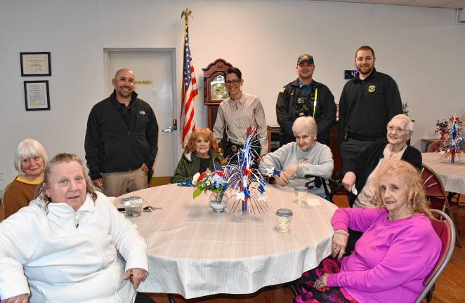 Newton. Coffee with a Cop NCC2 Detective Erik Soroka, Detective Sgt. Judy Torres, Patrolman Steven Siek and Detective Peter Vex of the Newton Police Department join senior citizens for coffee.