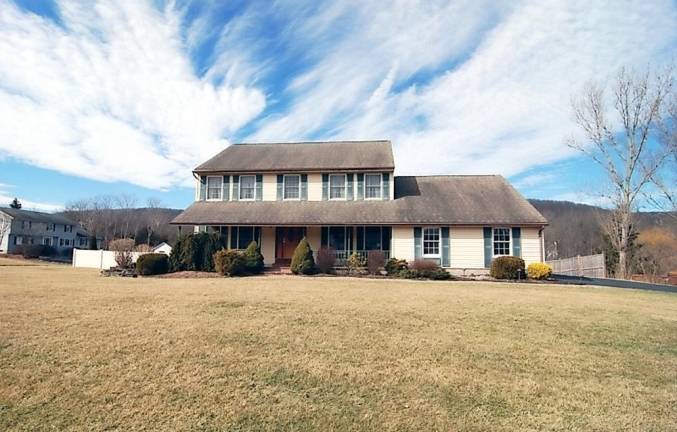 Spacious center hall colonial has in-ground pool Spacious center hall colonial has in-ground pool