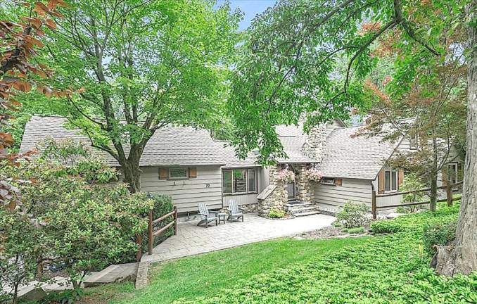 Charming Lake Mohawk home is nestled amid parklike grounds