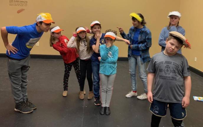 Arts Academy actors prepare for a performance of Honk Jr at The Newton Theatre.