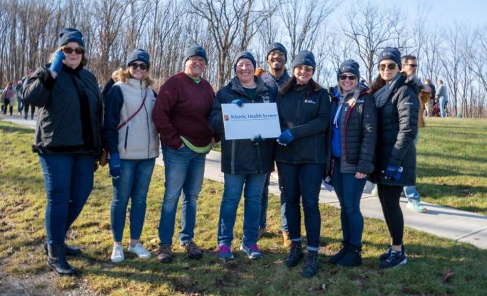 Volunteers from Atlantic Health Care helped place the wreaths.