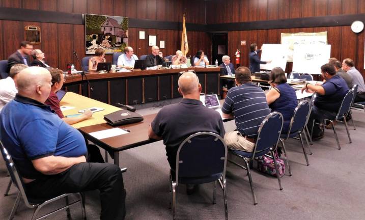 The Byram Township Council and municipal building subcommittee listen as Wassim Nader, principle of the Nader Group, LLC, goes over design plans for a potential new municipal complex, at a joint meeting held Tuesday, Aug 13, 2019.