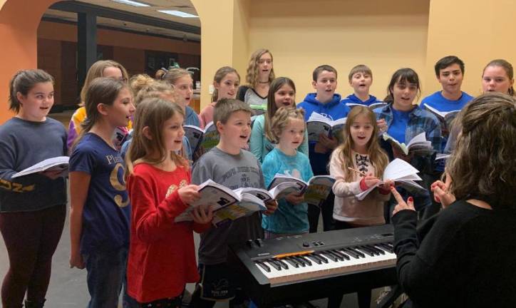 Children rehearse for a performance of Honk Jr.