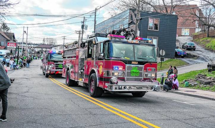 Newton Volunteer Fire Department trucks drive in the parade.