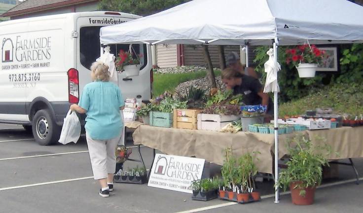 Farmside Gardens displays their items at the market on June 27. (Photo by Janet Redyke)