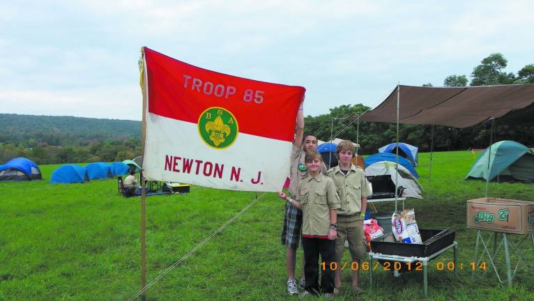 Space Farms hosts Sussex District Boy Scout Camporee Dustin and Chet from Sussex join Robbie from Augusta to help straighten out a Troop Flag at the Sussex District Camporee at Space Farms.