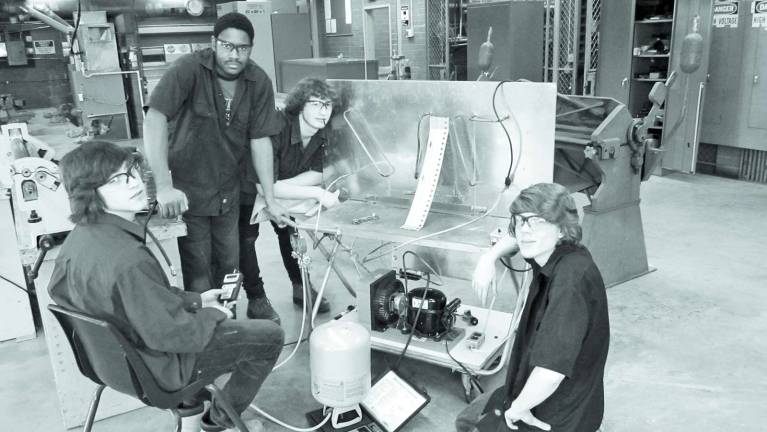 Focus on Sussex Tech School programs Photo provided From left, seniors Jonathan Burd and Andre Williams along with sophomores Brian Wolverton and Mark Eberle work on a refrigeration trainer.