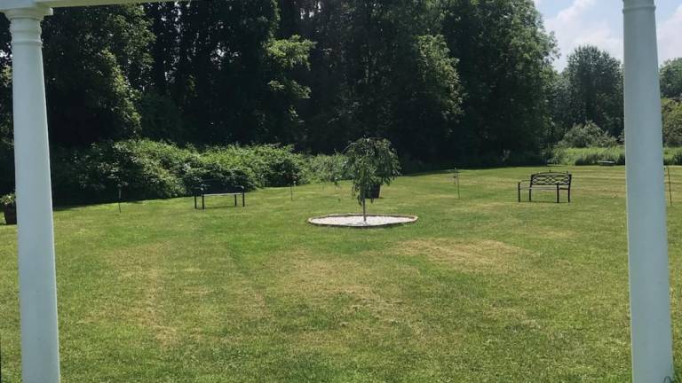 Father John's memorial garden offers peace and serenity Father John's memorial garden offers peace and serenity