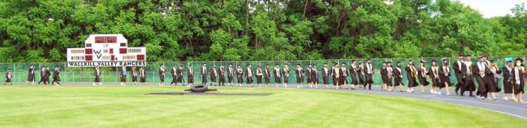‘All eyes are on the Class of 2020’ Students continue around the field. (Photo by Vera Olinsky)