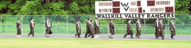 ‘All eyes are on the Class of 2020’ Students pass the 2020 scoreboard. (Photo by Vera Olinsky)