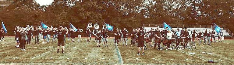 Making noise and wearing blue The Kittatinny Regional High School band rallies the crowd at the school's first pep rally of the season.